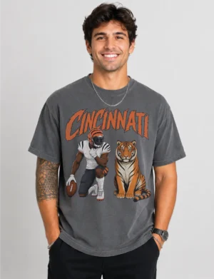 Cincinnati Football Tiger Graphic T-Shirt Model wearing a vintage-style Cincinnati football graphic T-shirt with a football player and tiger illustration