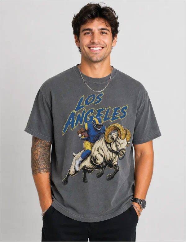 Los Angeles Football Football Shirt featuring a bold vintage-style football player and ram illustration printed on a soft black Comfort Colors tee. A great game day, tailgate, or gift shirt for Los Angeles Football fans. Los Angeles Football Football Shirt featuring a bold vintage-style football player and ram illustration printed on a soft black Comfort Colors tee. A great game day, tailgate, or gift shirt for Los Angeles Football fans.