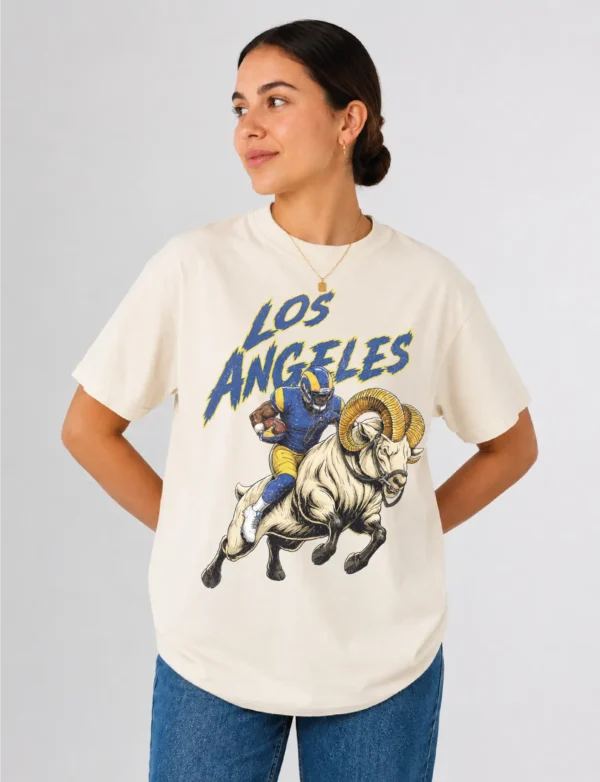Los Angeles Football Football Shirt featuring a bold vintage-style football player and ram illustration printed on a soft black Comfort Colors tee. A great game day, tailgate, or gift shirt for Los Angeles Football fans. Los Angeles Football Football Shirt featuring a bold vintage-style football player and ram illustration printed on a soft black Comfort Colors tee. A great game day, tailgate, or gift shirt for Los Angeles Football fans.