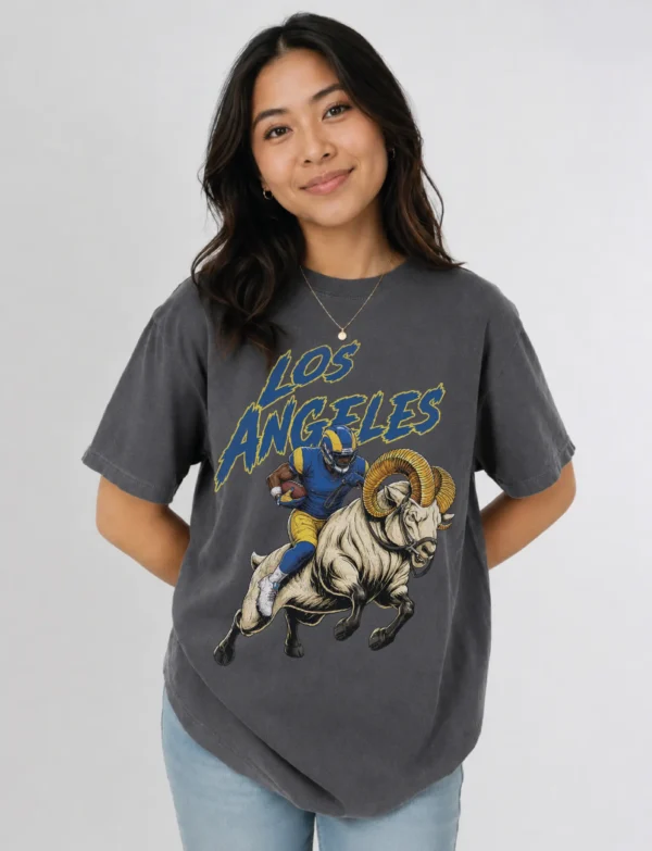 Los Angeles Football Football Shirt featuring a bold vintage-style football player and ram illustration printed on a soft black Comfort Colors tee. A great game day, tailgate, or gift shirt for Los Angeles Football fans. Los Angeles Football Football Shirt featuring a bold vintage-style football player and ram illustration printed on a soft black Comfort Colors tee. A great game day, tailgate, or gift shirt for Los Angeles Football fans.